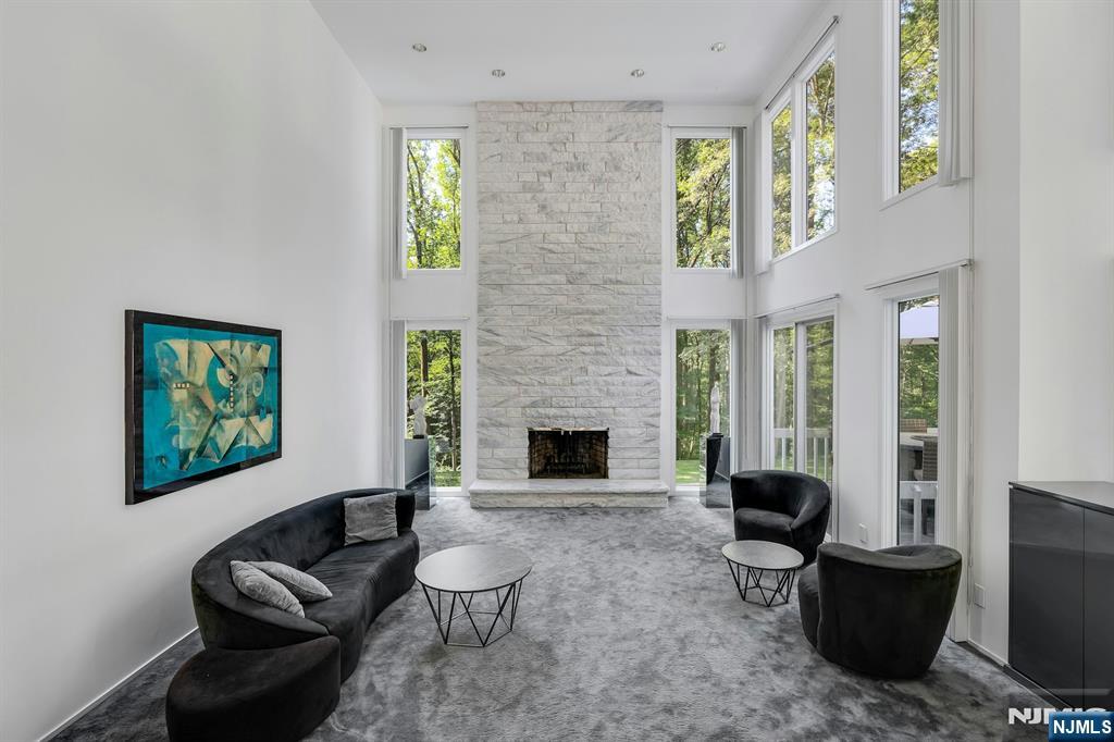 40 Jockey Hollow Road Bernardsville, NJ 07924 - Photo 11 of 49 a living room with furniture a window and a fireplace