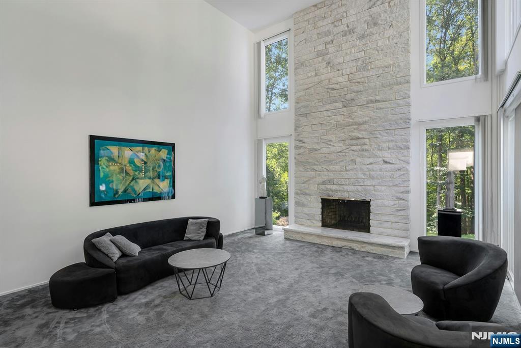 40 Jockey Hollow Road Bernardsville, NJ 07924 - Photo 12 of 49 a living room with furniture and a fireplace