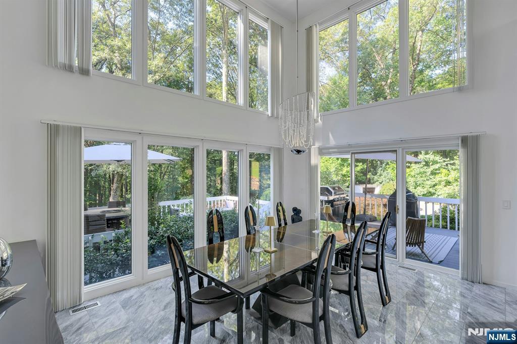 40 Jockey Hollow Road Bernardsville, NJ 07924 - Photo 14 of 49 a view of a dining room with furniture window and outside view