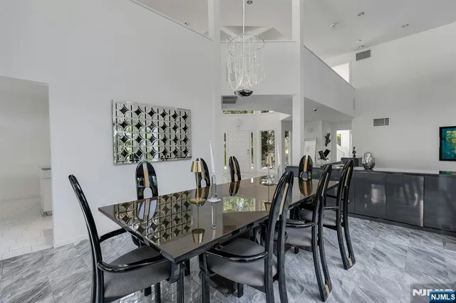 a dining room with furniture and wooden floor
