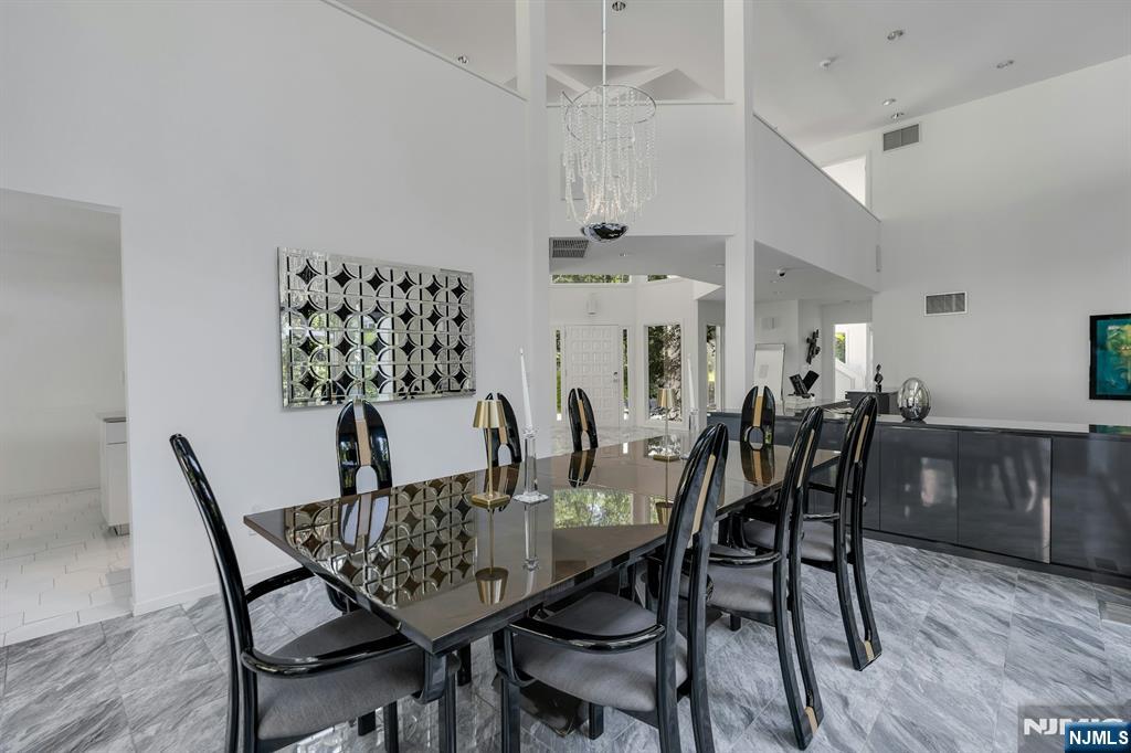 40 Jockey Hollow Road Bernardsville, NJ 07924 - Photo 15 of 49 a dining room with furniture and wooden floor