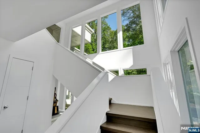 a view of room with window and stairs