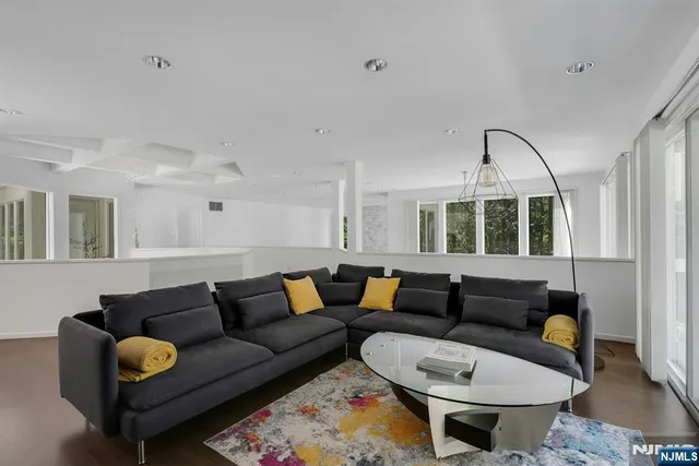 a living room with furniture and a large window