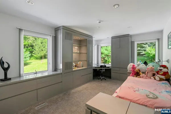 a living room filled with furniture and a window