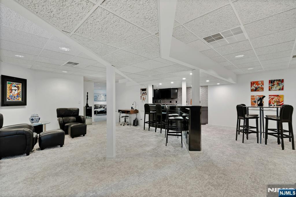 40 Jockey Hollow Road Bernardsville, NJ 07924 - Photo 40 of 49 a living room with furniture and a flat screen tv