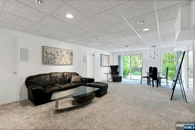 a living room with furniture rug and a table