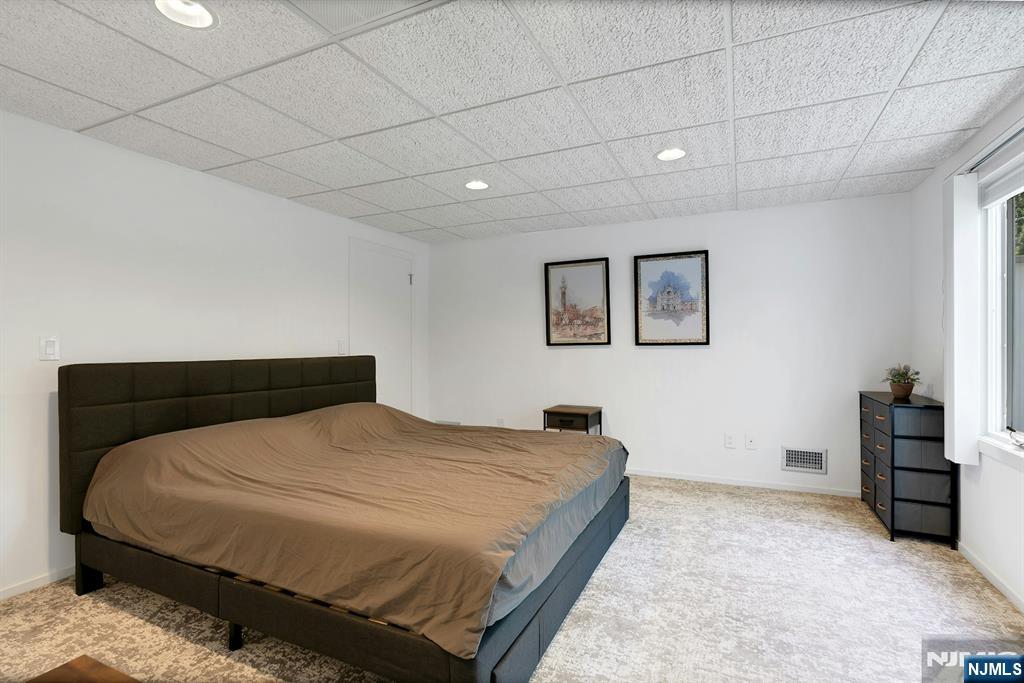 40 Jockey Hollow Road Bernardsville, NJ 07924 - Photo 44 of 49 a bedroom with a bed and a cabinets