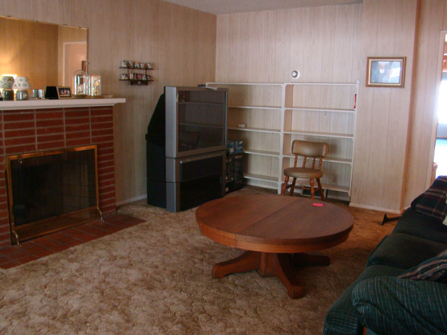 8170 Monterey Road Coyote, CA 95013 - Photo 4 of 17 a dining room with furniture and a fireplace