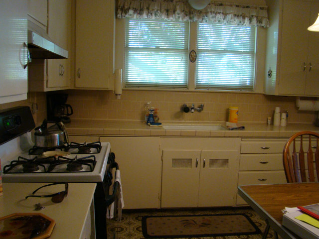 8170 Monterey Road Coyote, CA 95013 - Photo 6 of 17 a kitchen with a sink appliances cabinets and a window