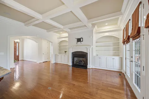 a kitchen with granite countertop a stove and cabinets