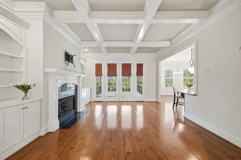 a kitchen with stainless steel appliances granite countertop a sink dishwasher and cabinets with wooden floor