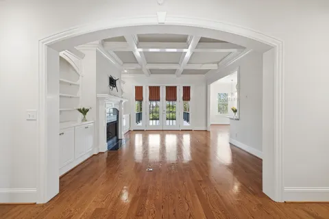 a kitchen with granite countertop wooden cabinets and a stove top oven