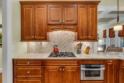 a view of a livingroom with a window and wooden floor