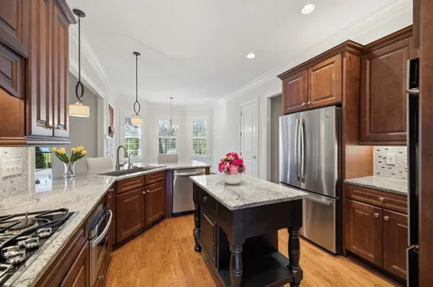 a bathroom with a double vanity sink mirror and shower