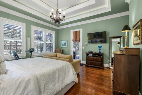 a bedroom with a bed and a book shelf
