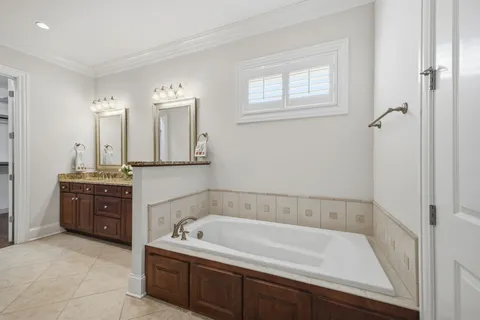 a living room with furniture ceiling fan and a flat screen tv