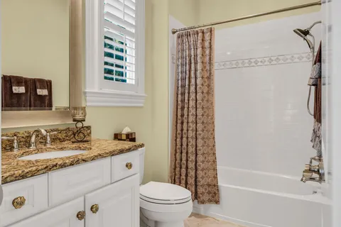 a view of balcony with couch and chairs