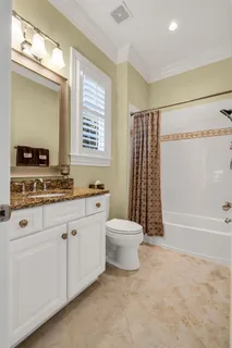 a view of a house with backyard and porch