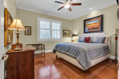 a view of a patio with table and chairs and potted plants