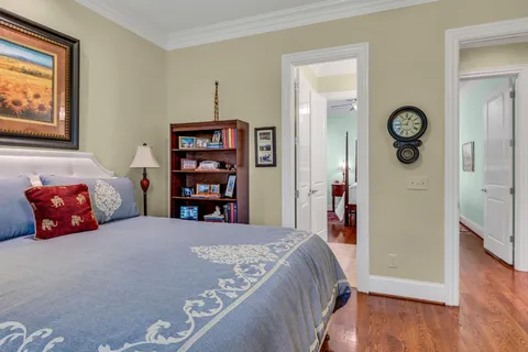 a view of a house with a big yard and large trees
