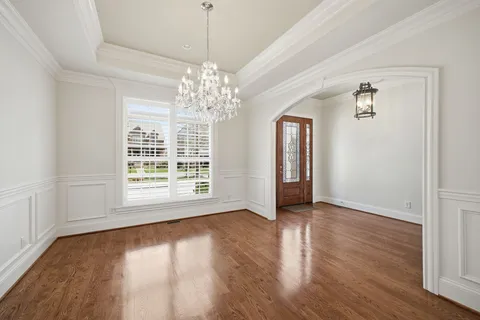 a view of livingroom with furniture a fireplace and wooden floor