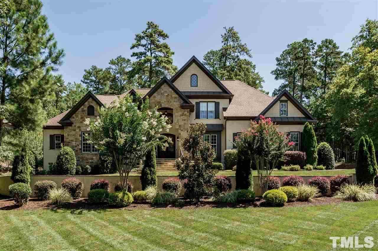 6020 Valencia Court Raleigh, NC 27614 - Photo 1 of 29 a front view of a house with a yard and potted plants