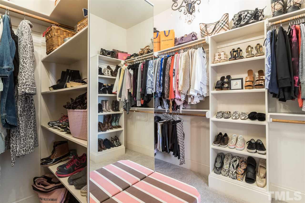 6020 Valencia Court Raleigh, NC 27614 - Photo 14 of 29 a view of walk in closet with clothes and shoes