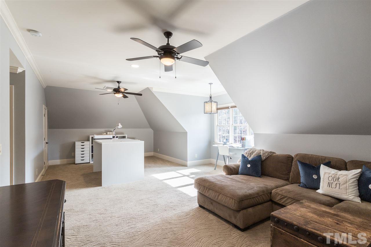6020 Valencia Court Raleigh, NC 27614 - Photo 19 of 29 a living room with a couch and a ceiling fan