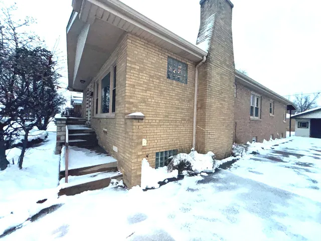 a view of a two chairs in the patio