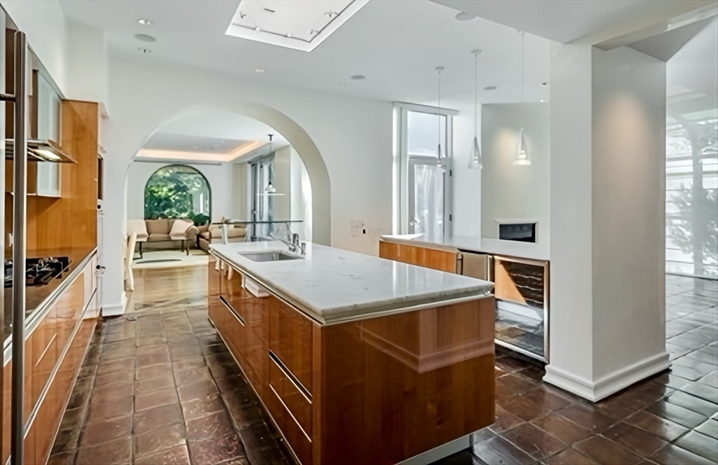 132 Yarmouth Road Brookline, MA 02467 - Photo 6 of 22 a kitchen with a stove and a refrigerator