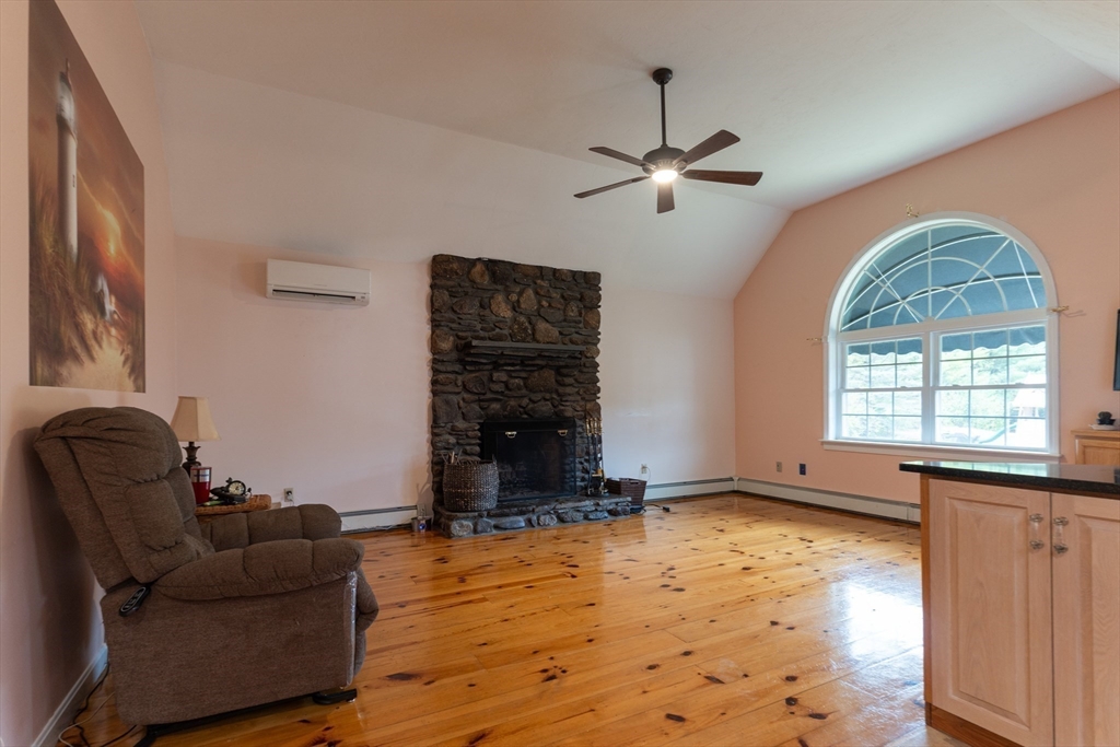 110 Hosley Road Gardner, MA 01440 - Photo 12 of 42 a living room with furniture and a fireplace