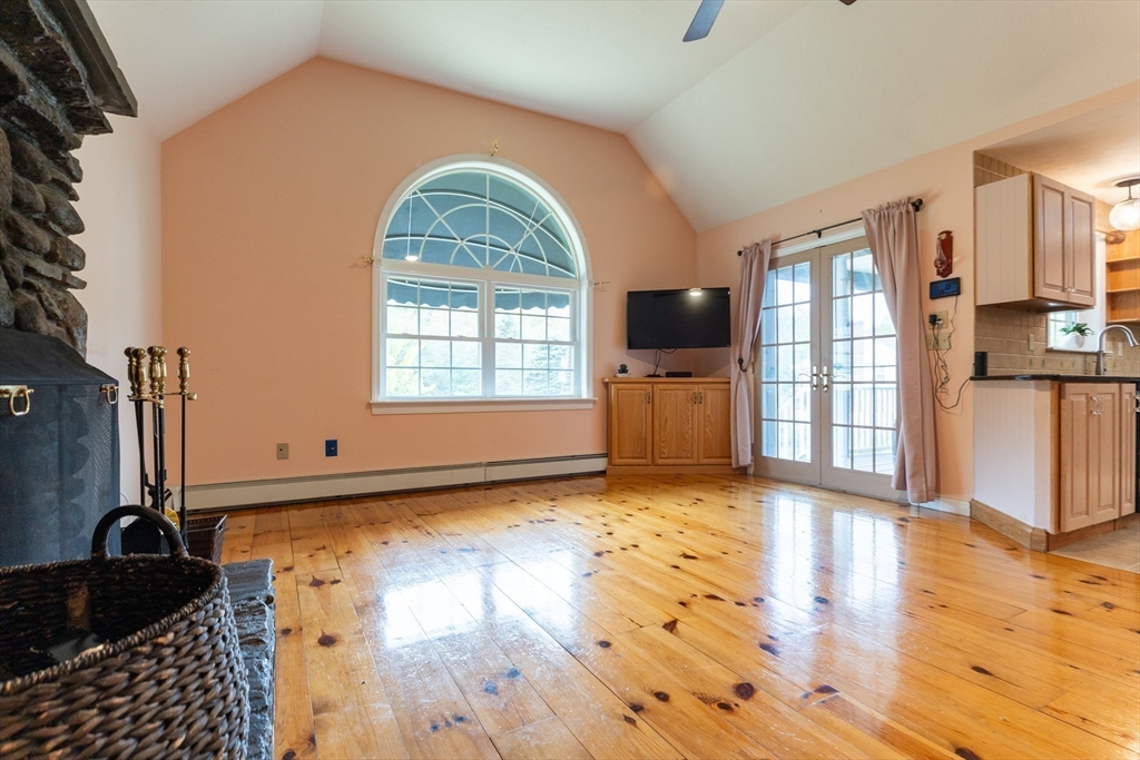 110 Hosley Road Gardner, MA 01440 - Photo 13 of 42 a view of an empty room with a window and wooden floor