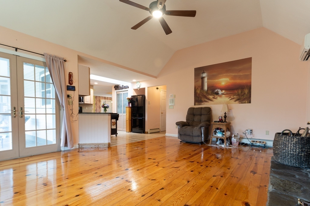 110 Hosley Road Gardner, MA 01440 - Photo 14 of 42 a living room with furniture and a flat screen tv