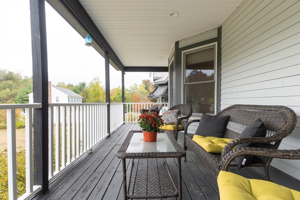 110 Hosley Road Gardner, MA 01440 - Photo 30 of 42 a living room with furniture fireplace and large windows