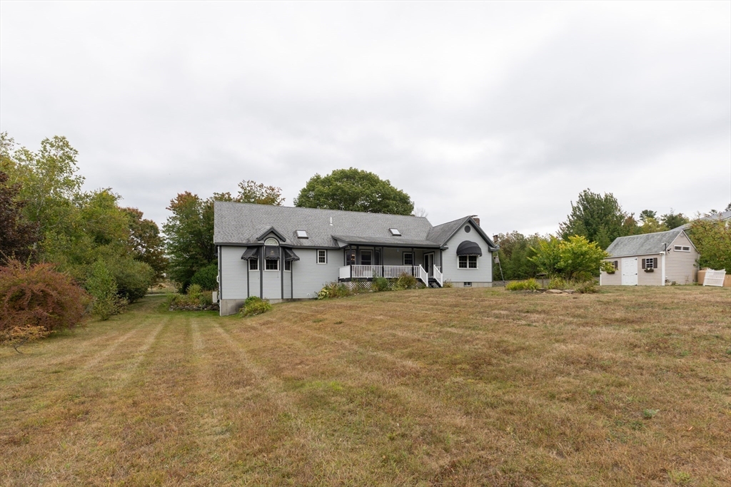 110 Hosley Road Gardner, MA 01440 - Photo 33 of 42 a view of a house with a yard