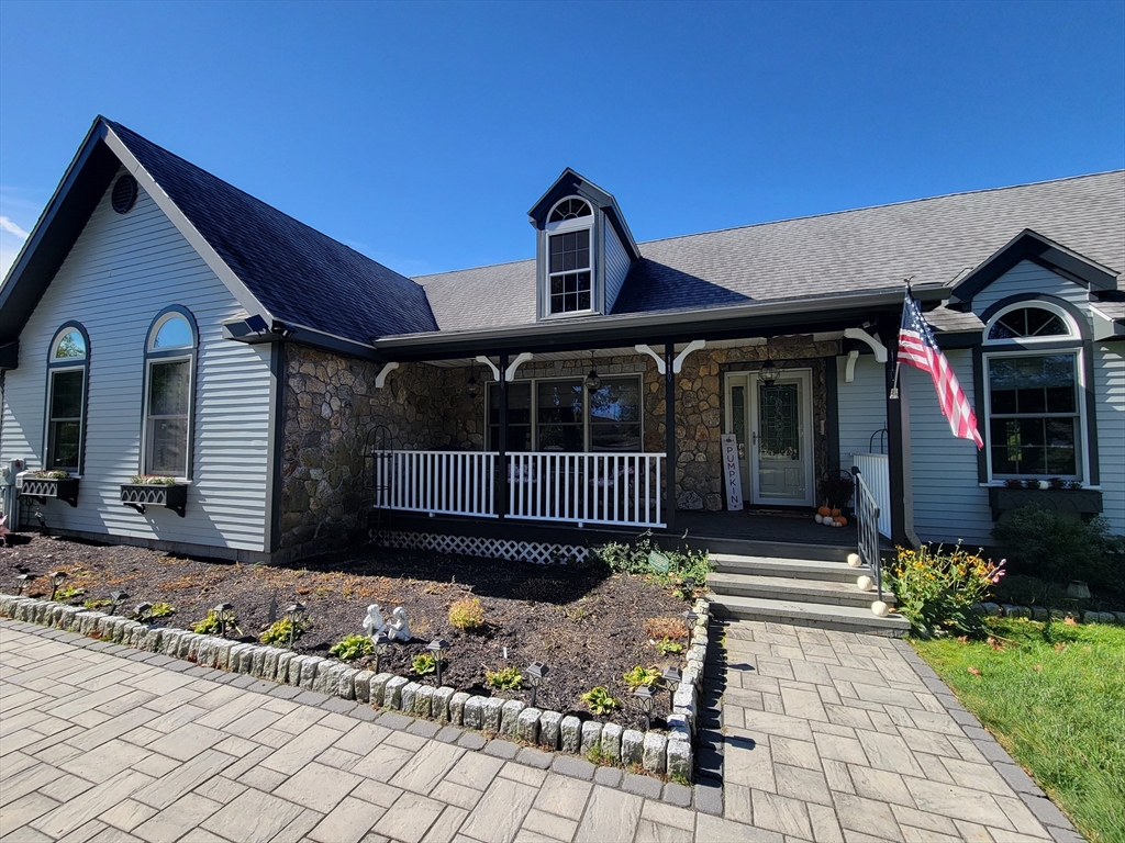 110 Hosley Road Gardner, MA 01440 - Photo 40 of 42 a front view of a house with a garden