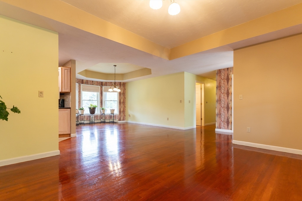 110 Hosley Road Gardner, MA 01440 - Photo 6 of 42 a view of empty room with wooden floor and fan