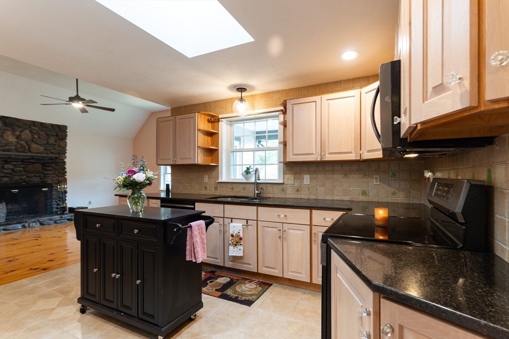 110 Hosley Road Gardner, MA 01440 - Photo 7 of 42 a kitchen with stainless steel appliances granite countertop a sink stove and cabinets