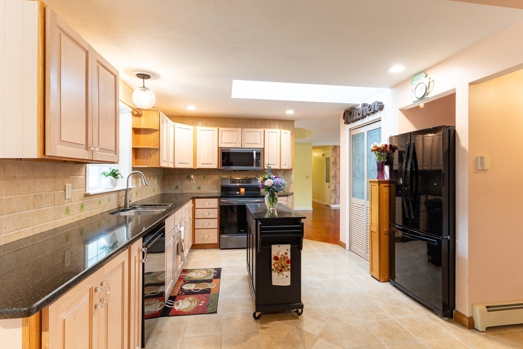 110 Hosley Road Gardner, MA 01440 - Photo 9 of 42 a kitchen with stainless steel appliances granite countertop a refrigerator stove and oven