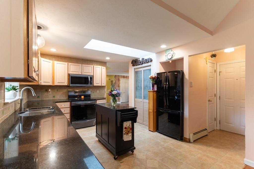 110 Hosley Road Gardner, MA 01440 - Photo 10 of 42 a kitchen with stainless steel appliances granite countertop a refrigerator stove and sink