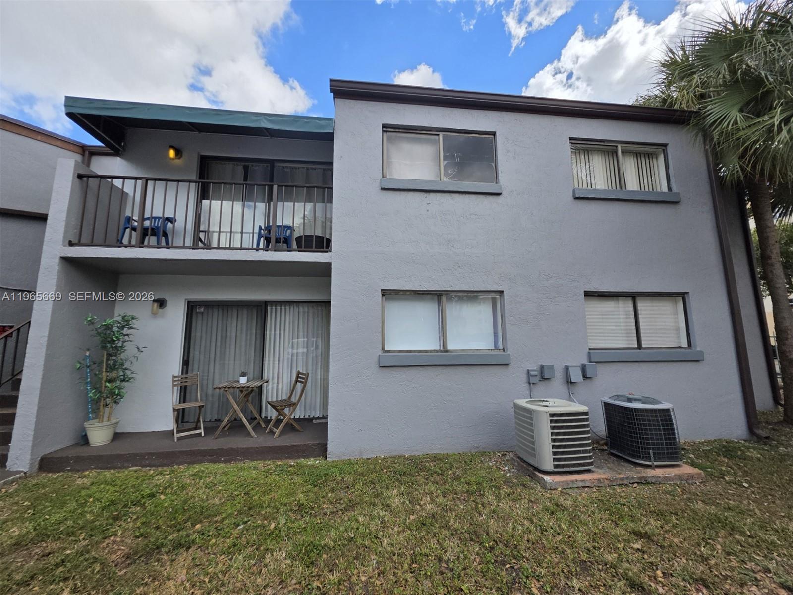7421 Southwest 152nd Avenue, Unit 9101 Miami, FL 33193 - Photo 1 of 32 a house view with a outdoor space