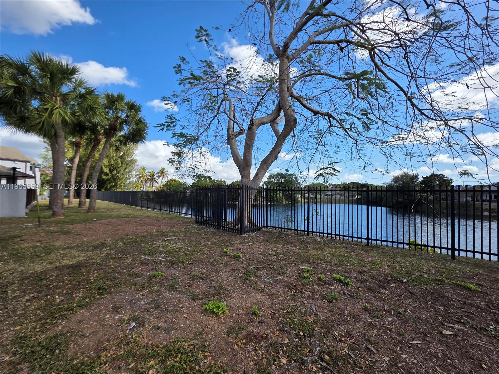 7421 Southwest 152nd Avenue, Unit 9101 Miami, FL 33193 - Photo 12 of 32 a view of backyard with tree
