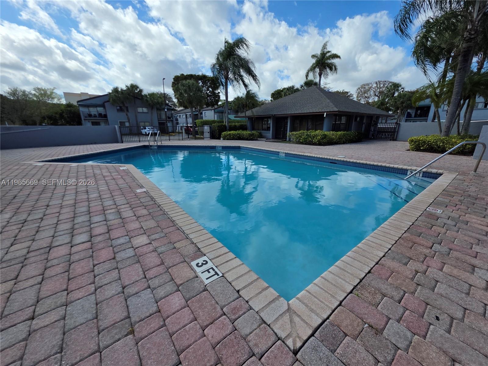 7421 Southwest 152nd Avenue, Unit 9101 Miami, FL 33193 - Photo 13 of 32 a view of a patio with chairs and a table with chairs