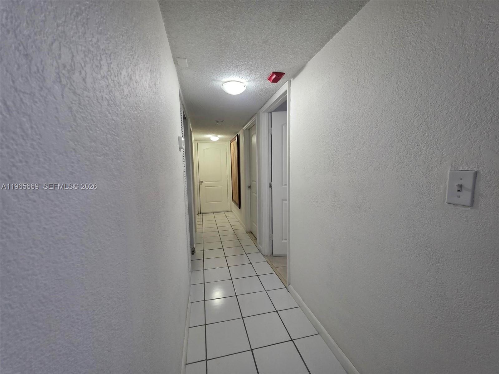 7421 Southwest 152nd Avenue, Unit 9101 Miami, FL 33193 - Photo 29 of 32 a view of a hallway