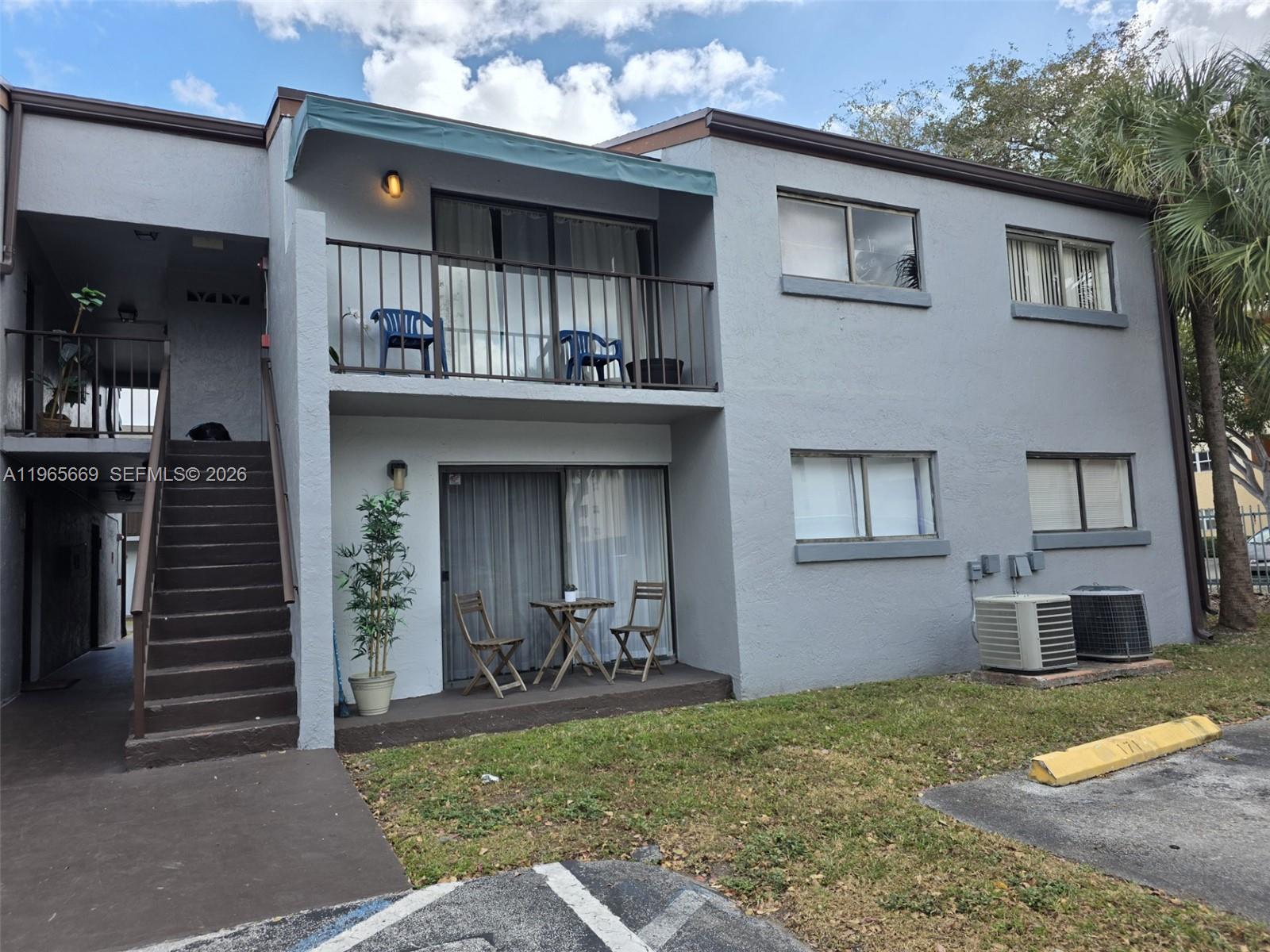 7421 Southwest 152nd Avenue, Unit 9101 Miami, FL 33193 - Photo 3 of 32 a view of a house with a outdoor space