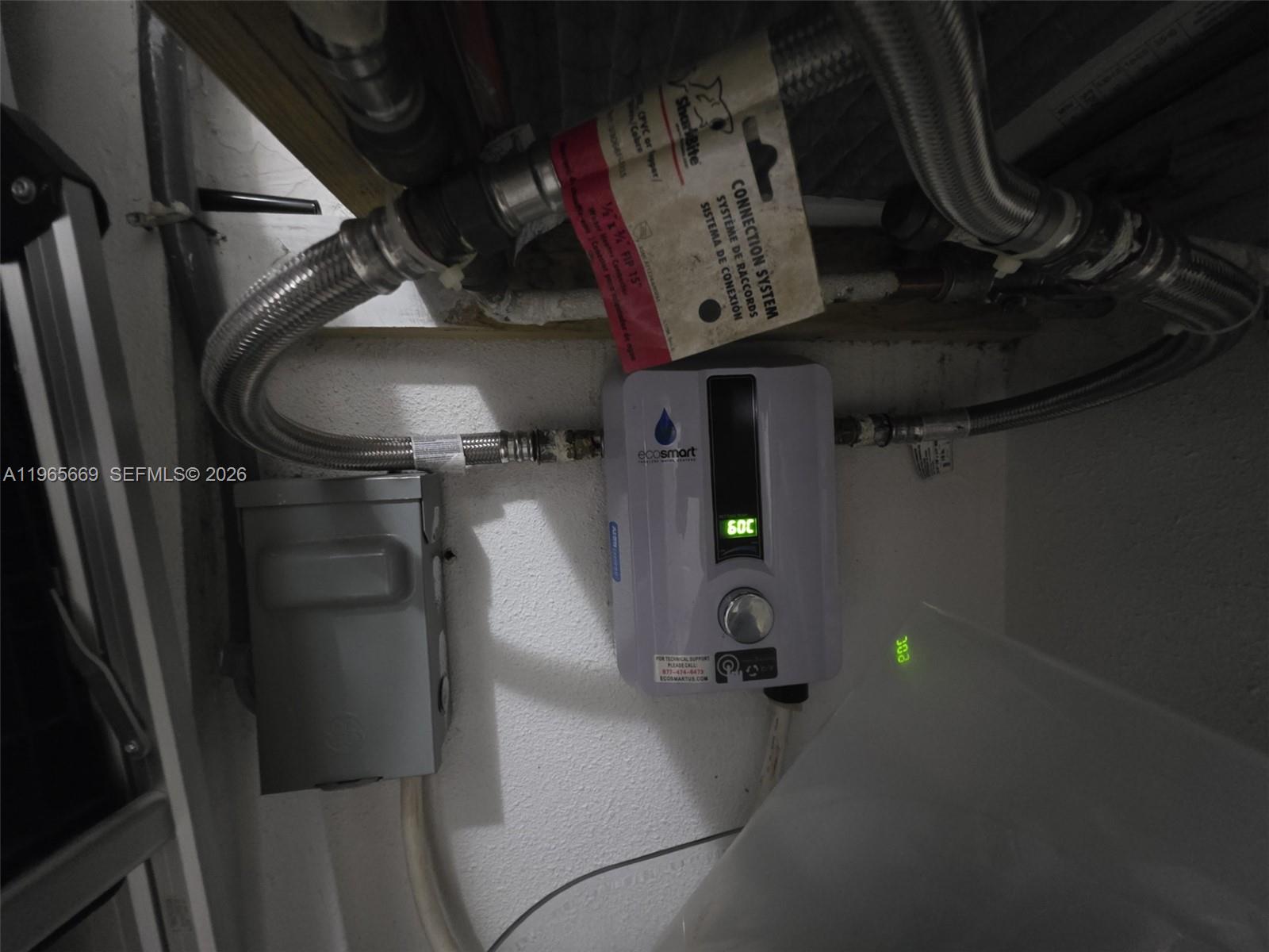 7421 Southwest 152nd Avenue, Unit 9101 Miami, FL 33193 - Photo 31 of 32 a close view of water heater room
