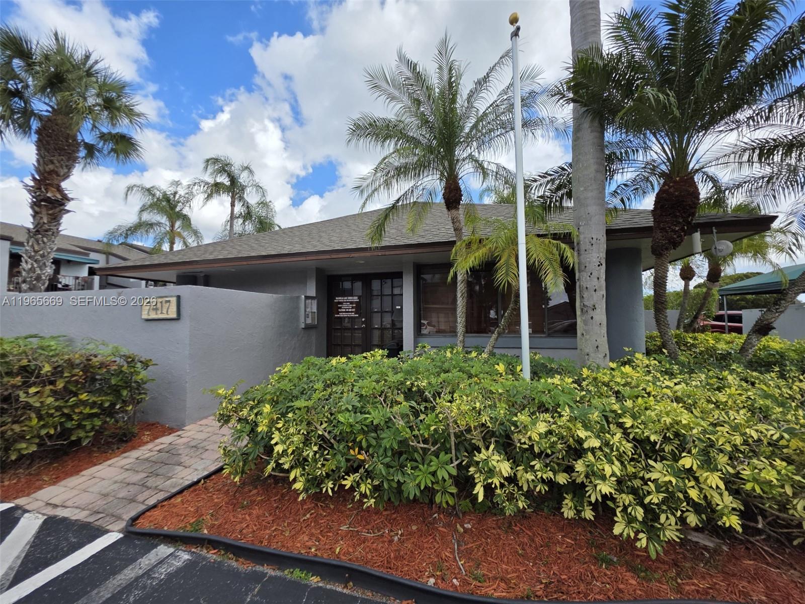 7421 Southwest 152nd Avenue, Unit 9101 Miami, FL 33193 - Photo 7 of 32 front view of a house with a garden