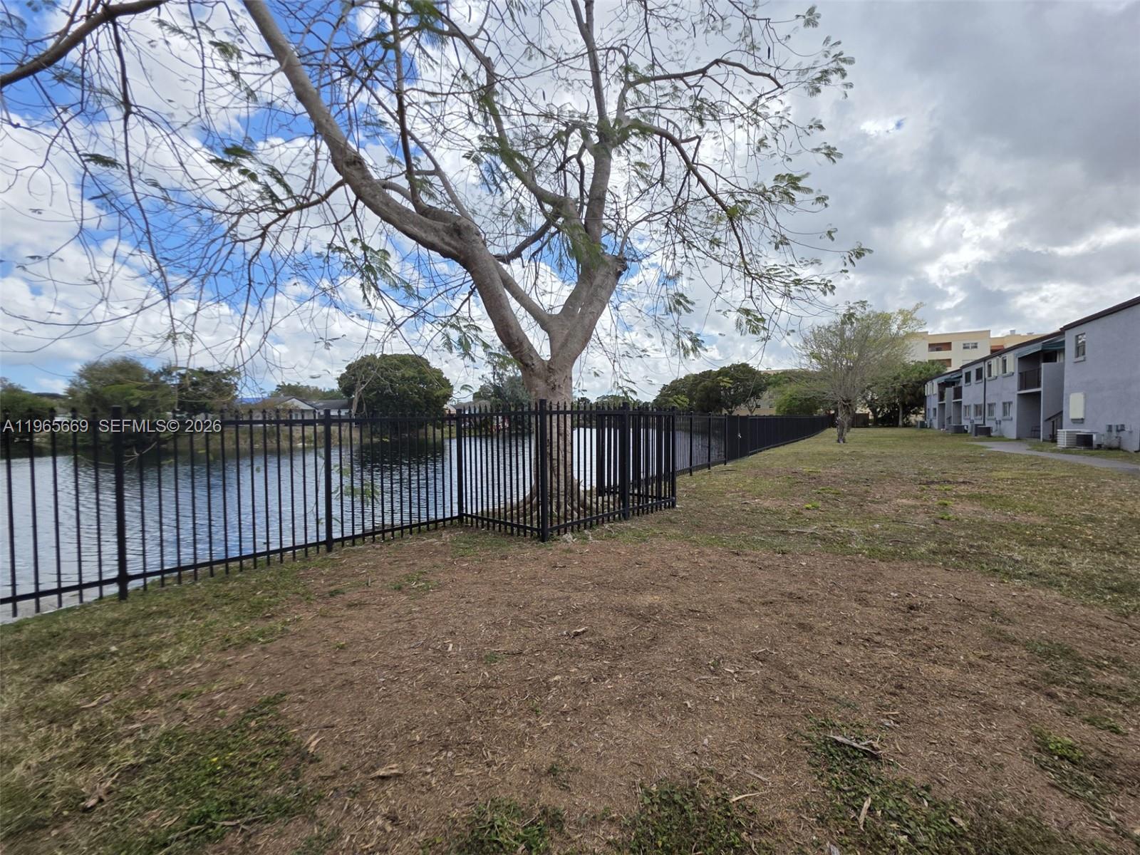 7421 Southwest 152nd Avenue, Unit 9101 Miami, FL 33193 - Photo 8 of 32 a view of a backyard with wooden fence