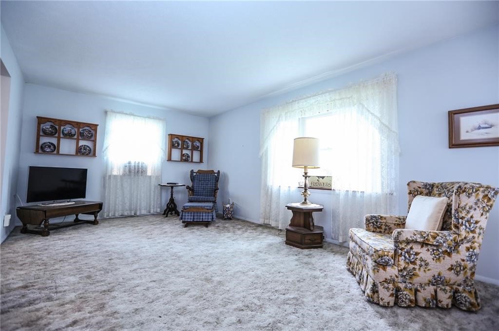 668 Long Pond Road Greece, NY 14612 - Photo 7 of 17 REAR FAMILY ROM WITH THREE BAY WINDOW