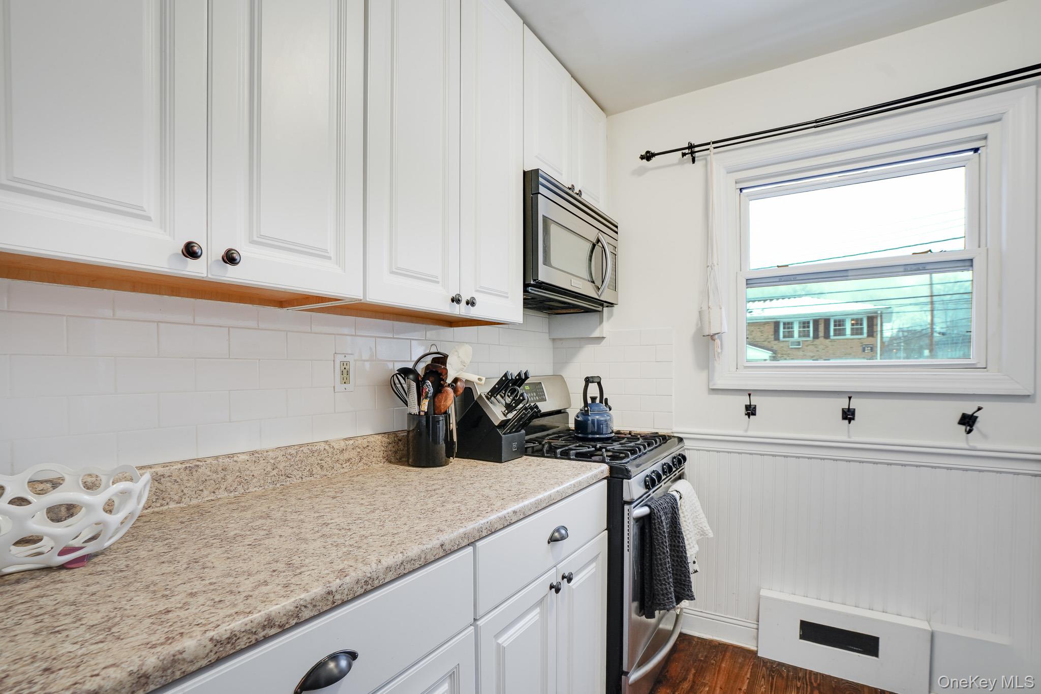 10 Tappan Landing Road, Unit 53A Tarrytown, NY 10591 - Photo 13 of 20 a kitchen with a sink cabinets and window